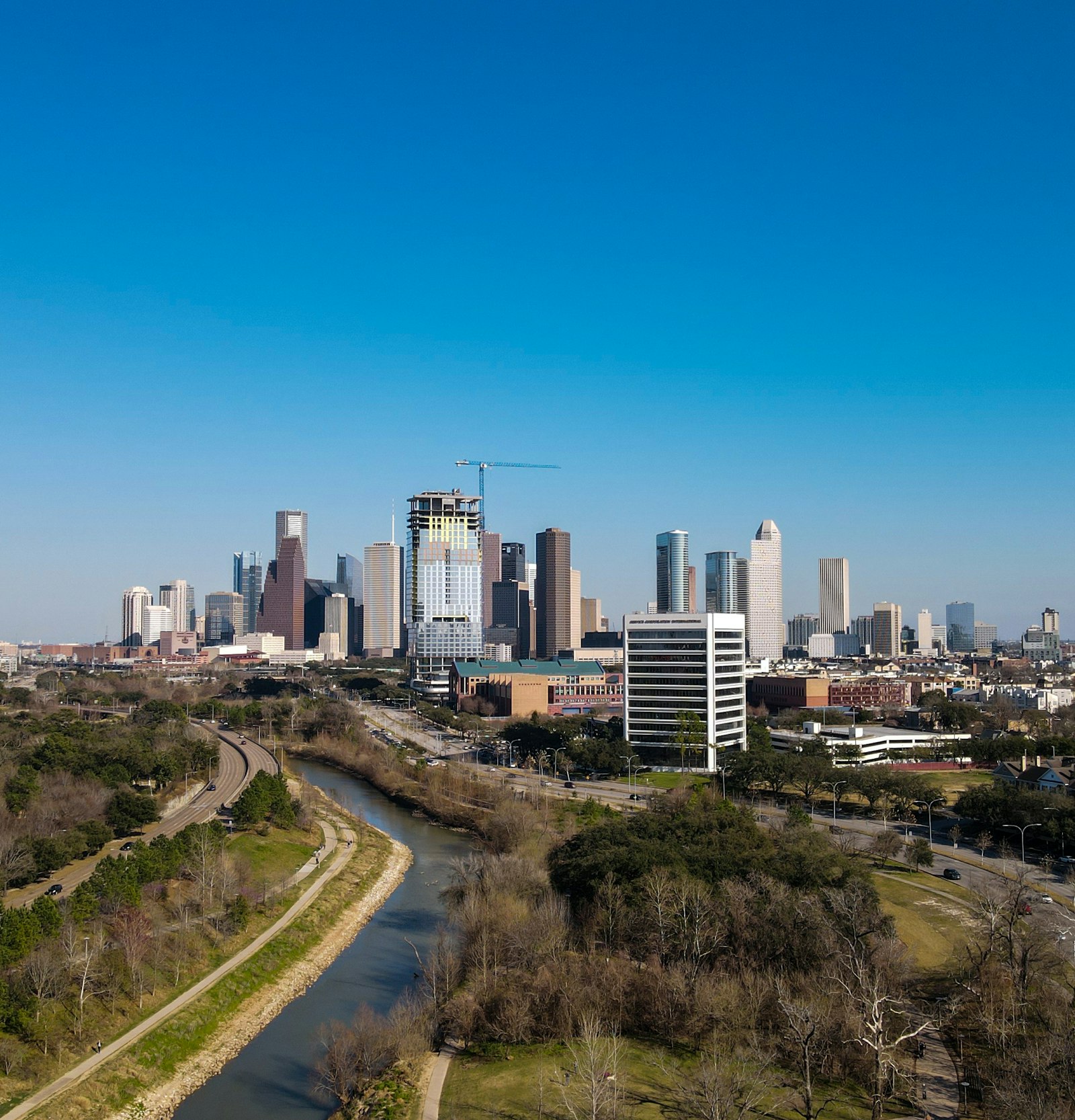 Houston camera crew location: Buffalo Bayou winding toward the downtown skyline