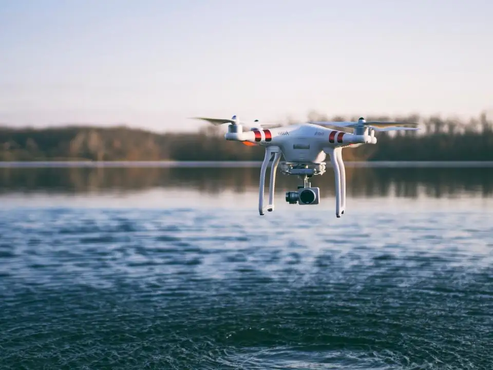 Drone hovering low over a lake