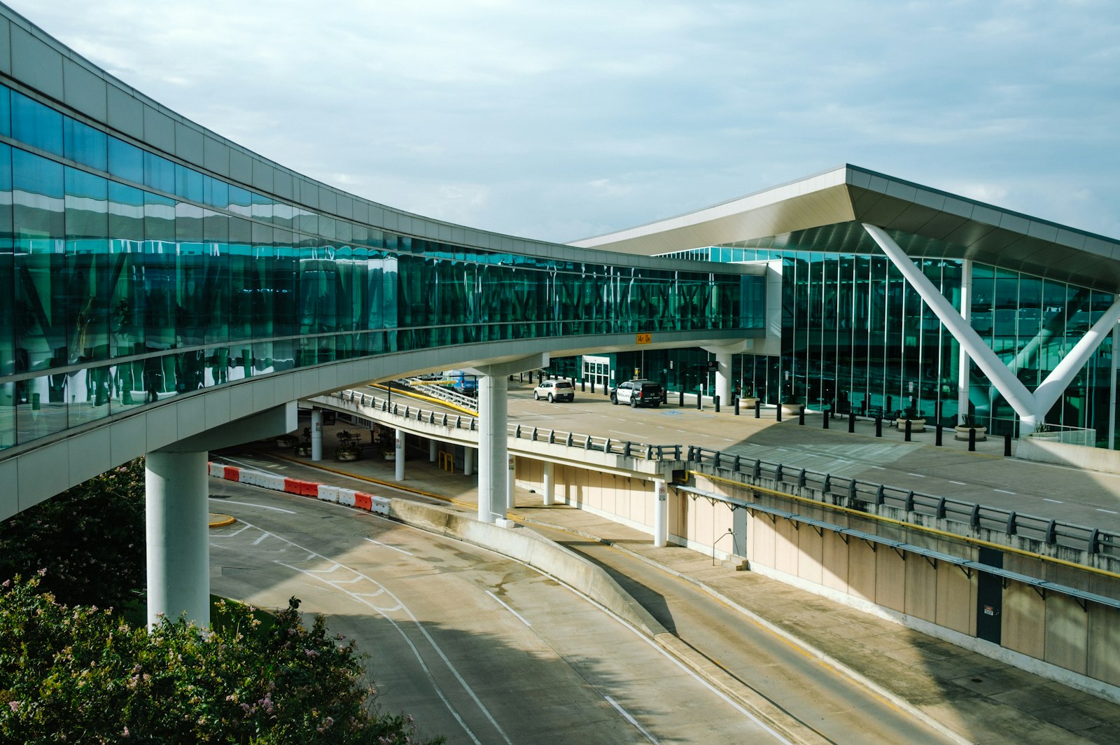 Curved walkway leading to the terminal at Houston Hobby Airport