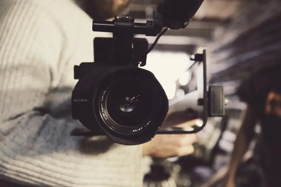 Close up of a professional video camera on set