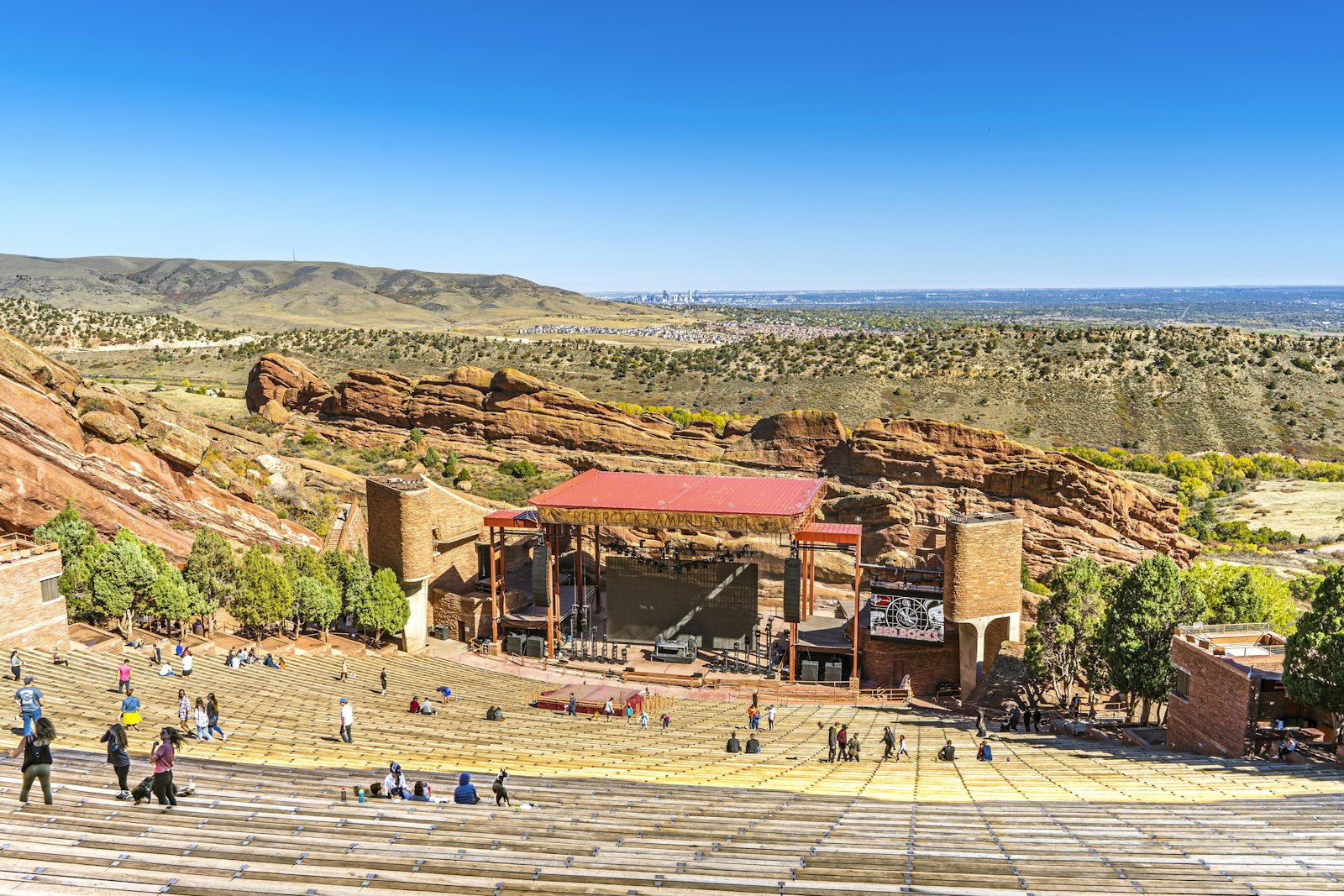 View down the rows of Red Rocks Amphitheatre toward the stage and the plains