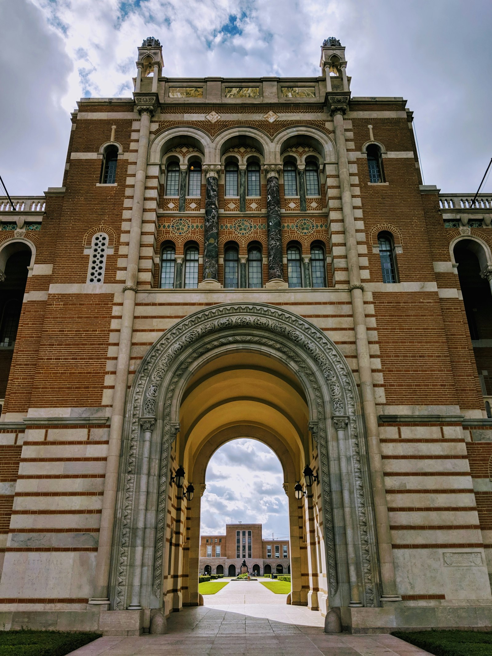 Arched brick gateway on the Rice University campus in Houston